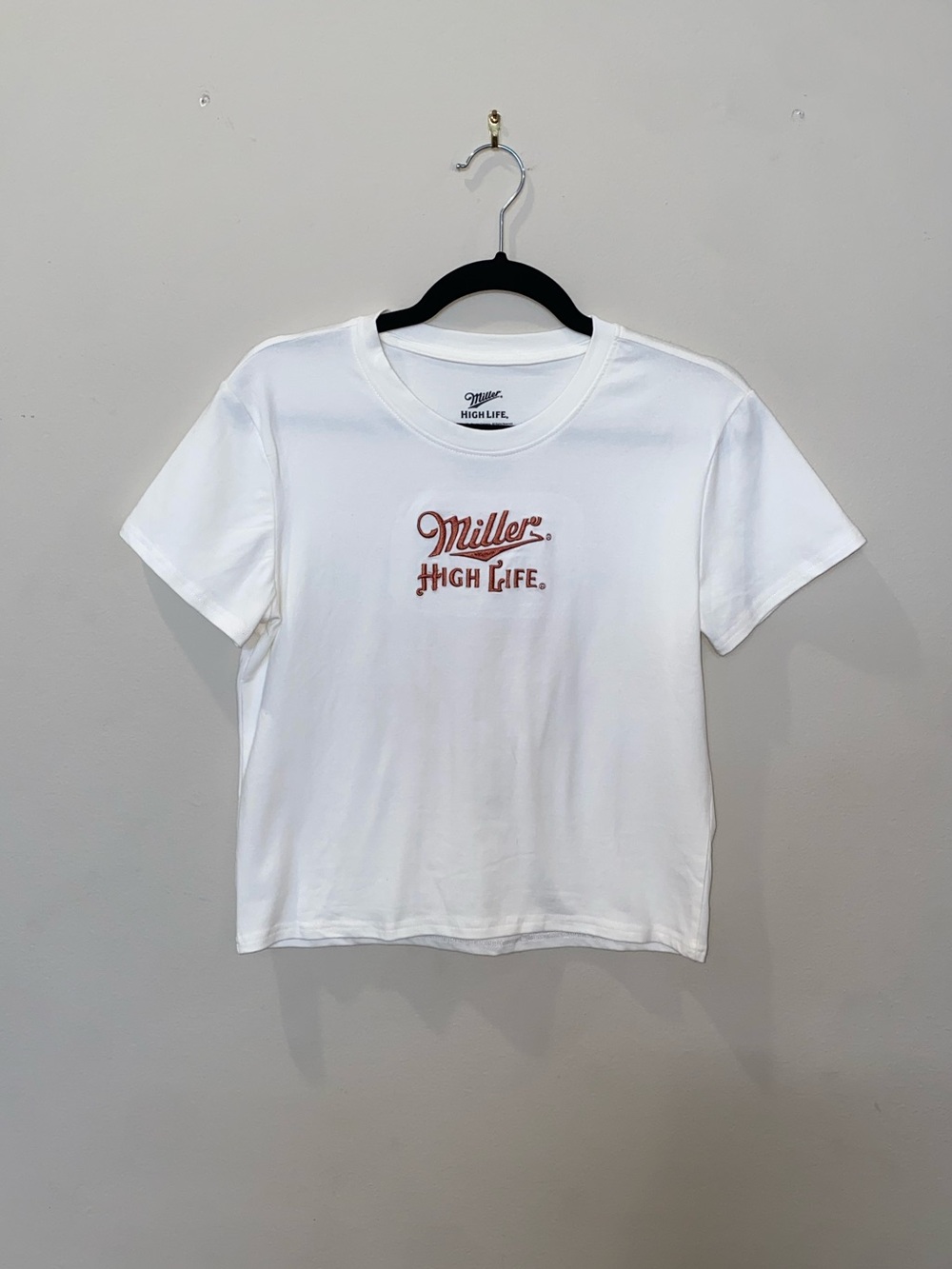 Y2K Miller High Life Women's White Graphic Baby Tee with Rust Embroidered Logo